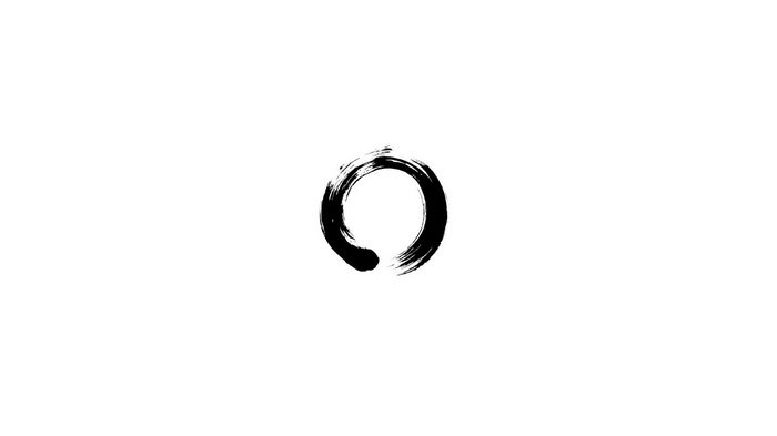 A black ensō circle on a white background