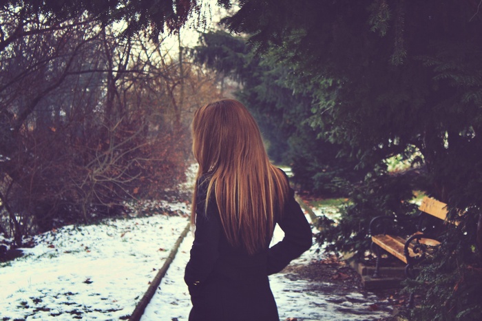 Woman with long brown hair in a winter park