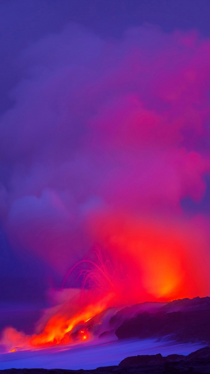 Volcano erupting with lava and smoke