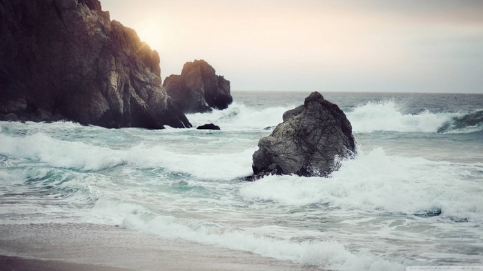Waves crashing against rocky shore