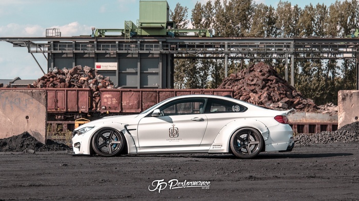 JP Performance white BMW M4 coupe with custom body kit