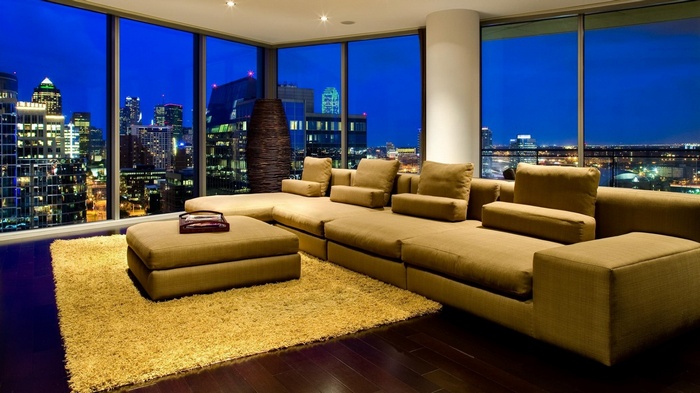 Modern living room with city view at night