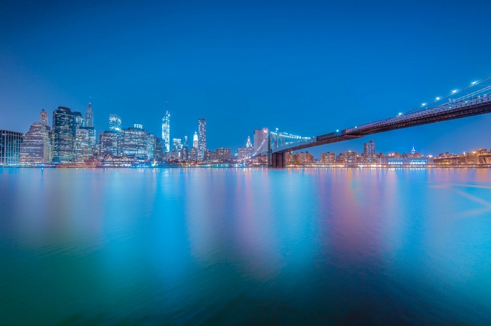 New York City skyline and Brooklyn Bridge at night