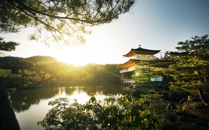 Golden Pavilion temple reflected in a pond in Kyoto, Japan