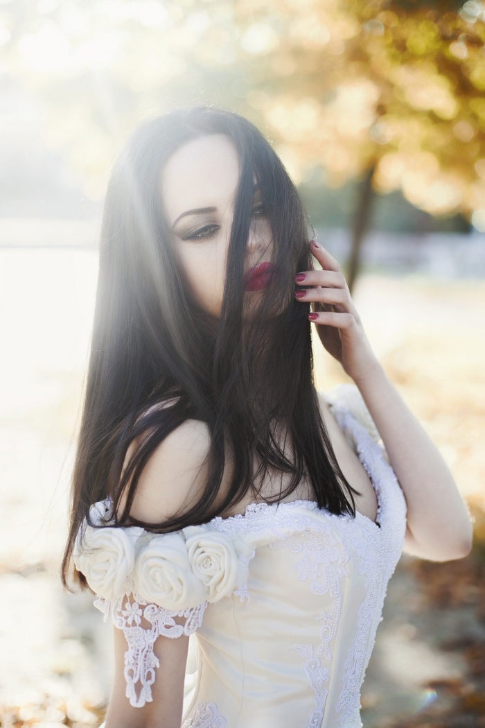 Woman in a white dress with roses