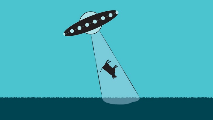 UFO abducting a cow with a light beam