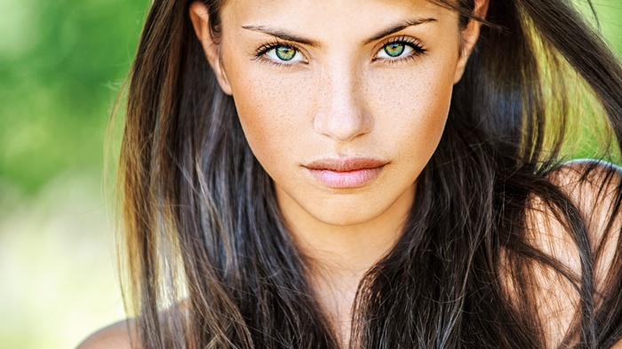 Woman with freckles and green eyes