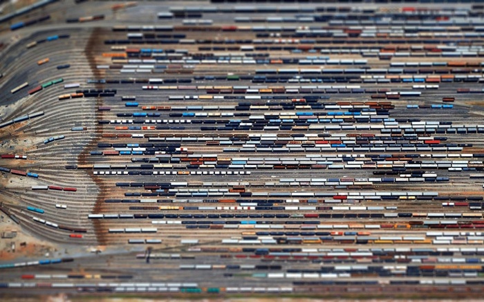 Aerial view of a busy train yard with many railcars