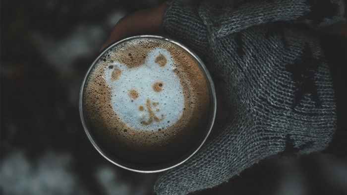 Coffee with bear latte art in a mug