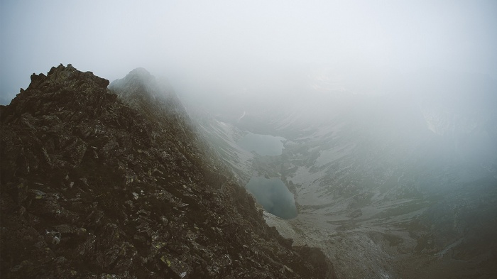 Misty mountain landscape with lakes