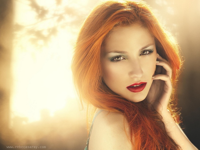 Woman with red hair and red lipstick