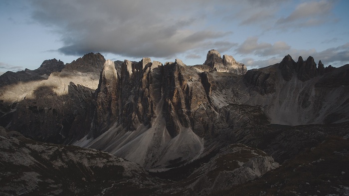 Jagged mountain peaks under a cloudy sky