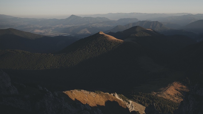 Mountain landscape at sunset with shadows