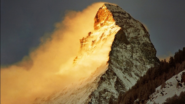 The Matterhorn mountain bathed in golden light