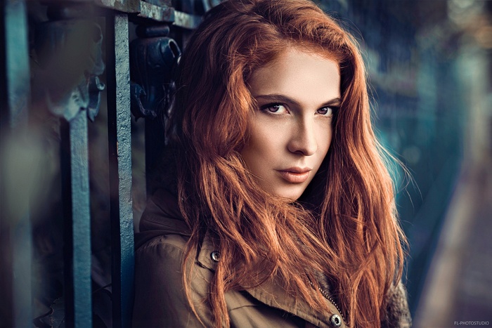 Redhead woman with long hair outdoors