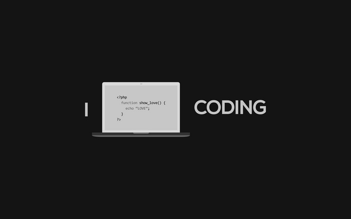 Laptop displaying PHP code with the word CODING