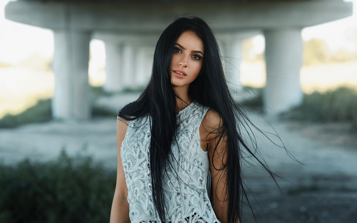 Darina with long dark hair outdoors