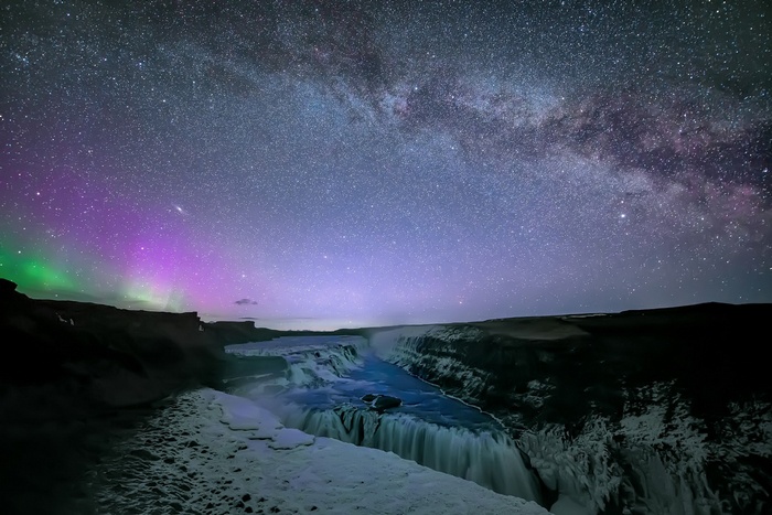 Aurora Borealis over Gullfoss waterfall under the Milky Way