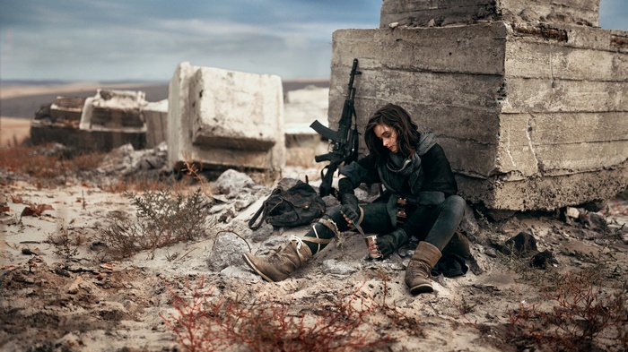 Brunette with AK-74 in desert ruins