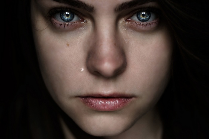 Close-up of a woman's face with tears
