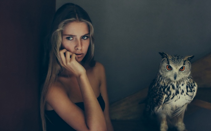 Woman and owl on stairs