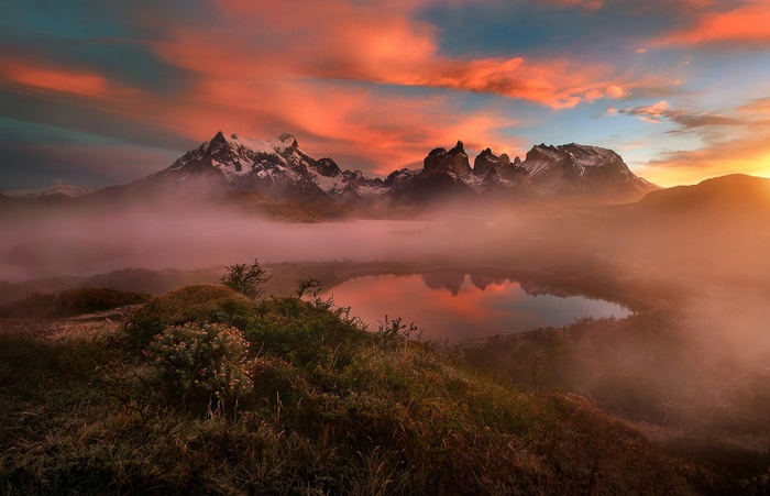 Mountains and clouds over a lake at sunset