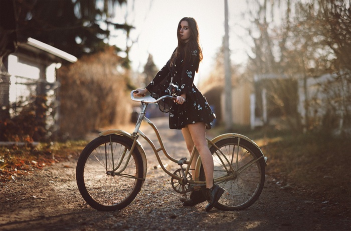 Woman in a dress with a bicycle