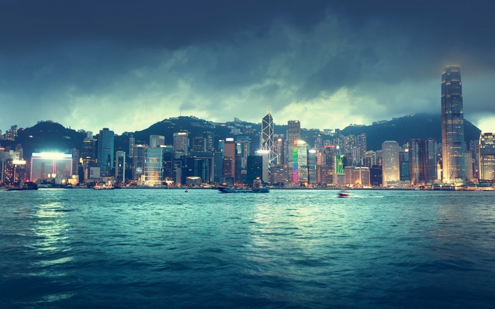 Hong Kong skyline at night with harbor