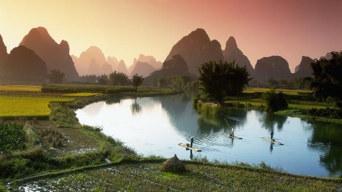 Karst mountains and river in China at sunset