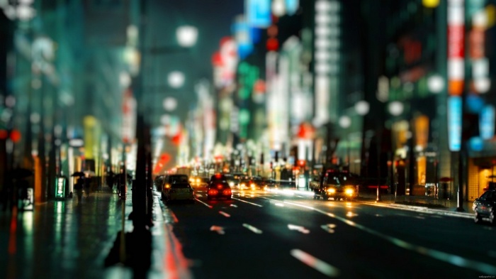 Nighttime city street with traffic and bokeh lights