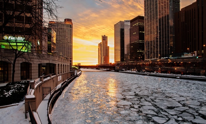Chicago River at sunset with ice floes