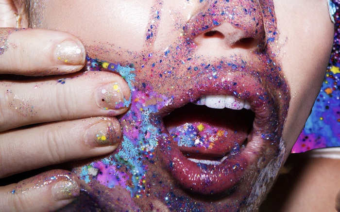 Miley Cyrus covered in colorful glitter