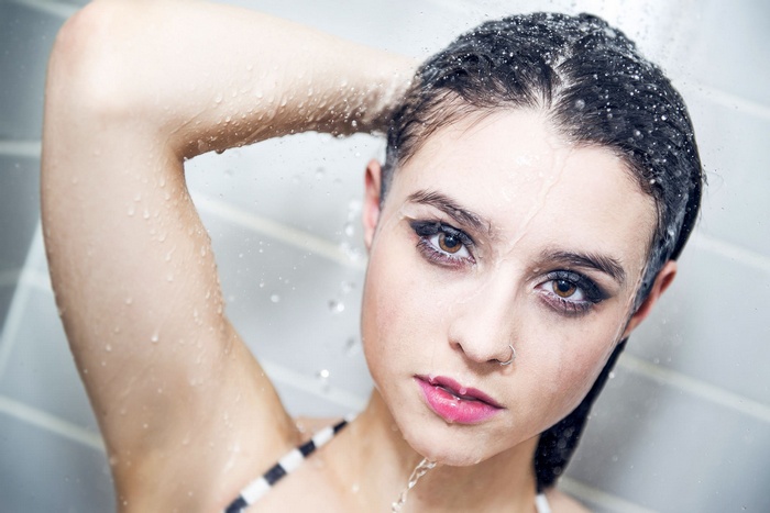 Woman with wet hair in the shower