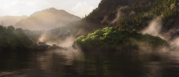 Misty mountains and a village by the lake at sunrise