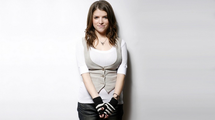 Anna Kendrick wearing a vest and striped fingerless gloves