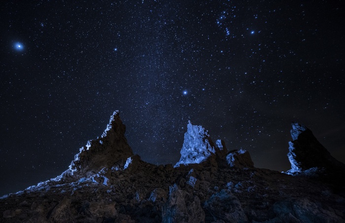 Rocky landscape under a starry night sky