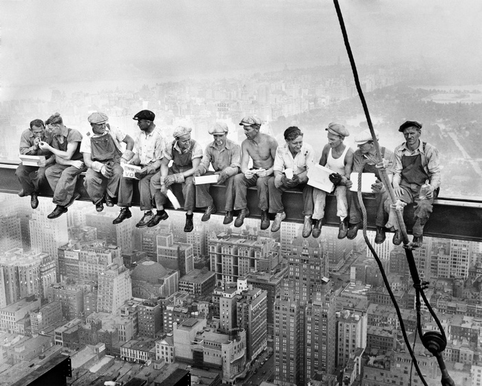 Workers eating lunch on a steel beam