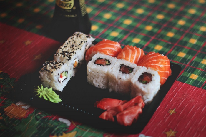 Sushi and soy sauce bottle on a table