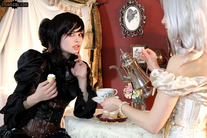 Steampunk girls having tea with cupcakes