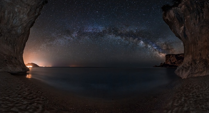 Sardinia beach cave under the Milky Way galaxy