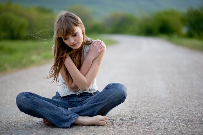 road, trees, closed eyes, model, barefoot, women outdoors, windy, brunette, bare shoulders, women, bangs, depth of field, jeans, sitting, makeup, legs, nature, long hair, tank top