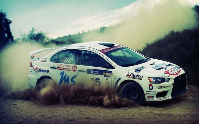Mitsubishi Lancer Rally Car Driving Through Dust