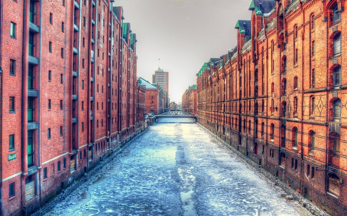 Hamburg Speicherstadt with frozen canal and bridge