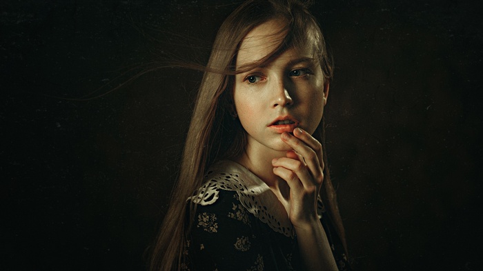 Portrait of a young woman with long hair