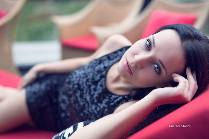 Angelina Petrova in a sequined dress with blue eyes