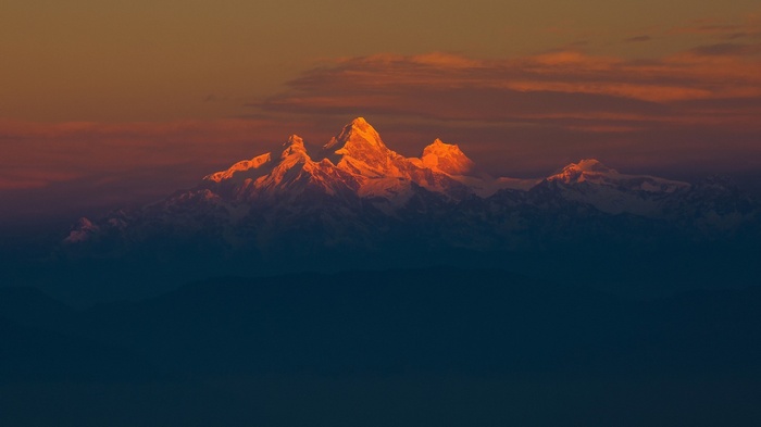 Himalayas mountains at sunset with golden light