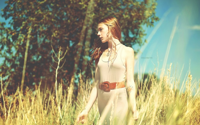 Woman with long hair in a field