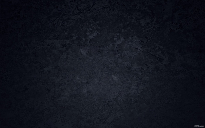 Dark textured surface with subtle lighting