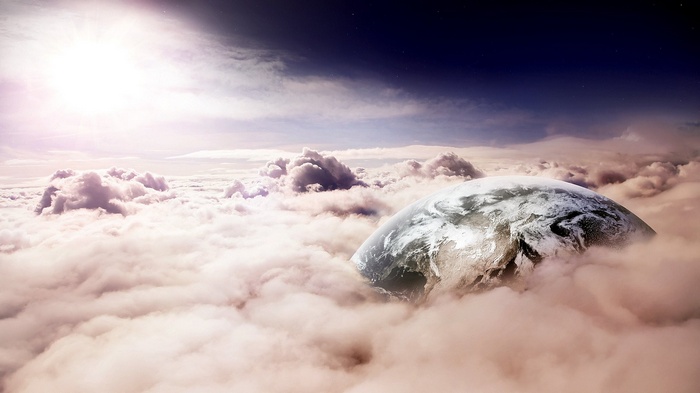 Earth emerging from clouds with sun and stars