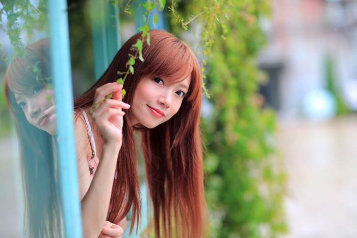 Asian woman with long brown hair
